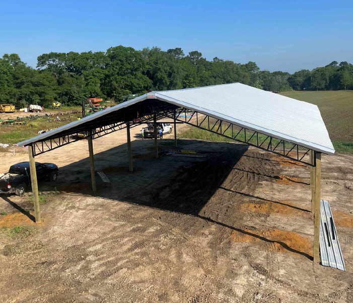 pole barn on site A pole barn on site is ready to be used on farm for livestock shelter and equipment storage.